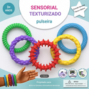 Conjunto de 5 pulseiras sensoriais Zem Kids para alívio de ansiedade e TDAH, usadas no pulso, em cores variadas.